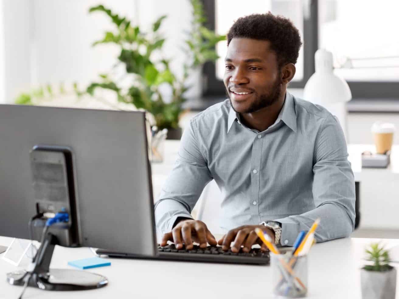 company employee working at computer in office