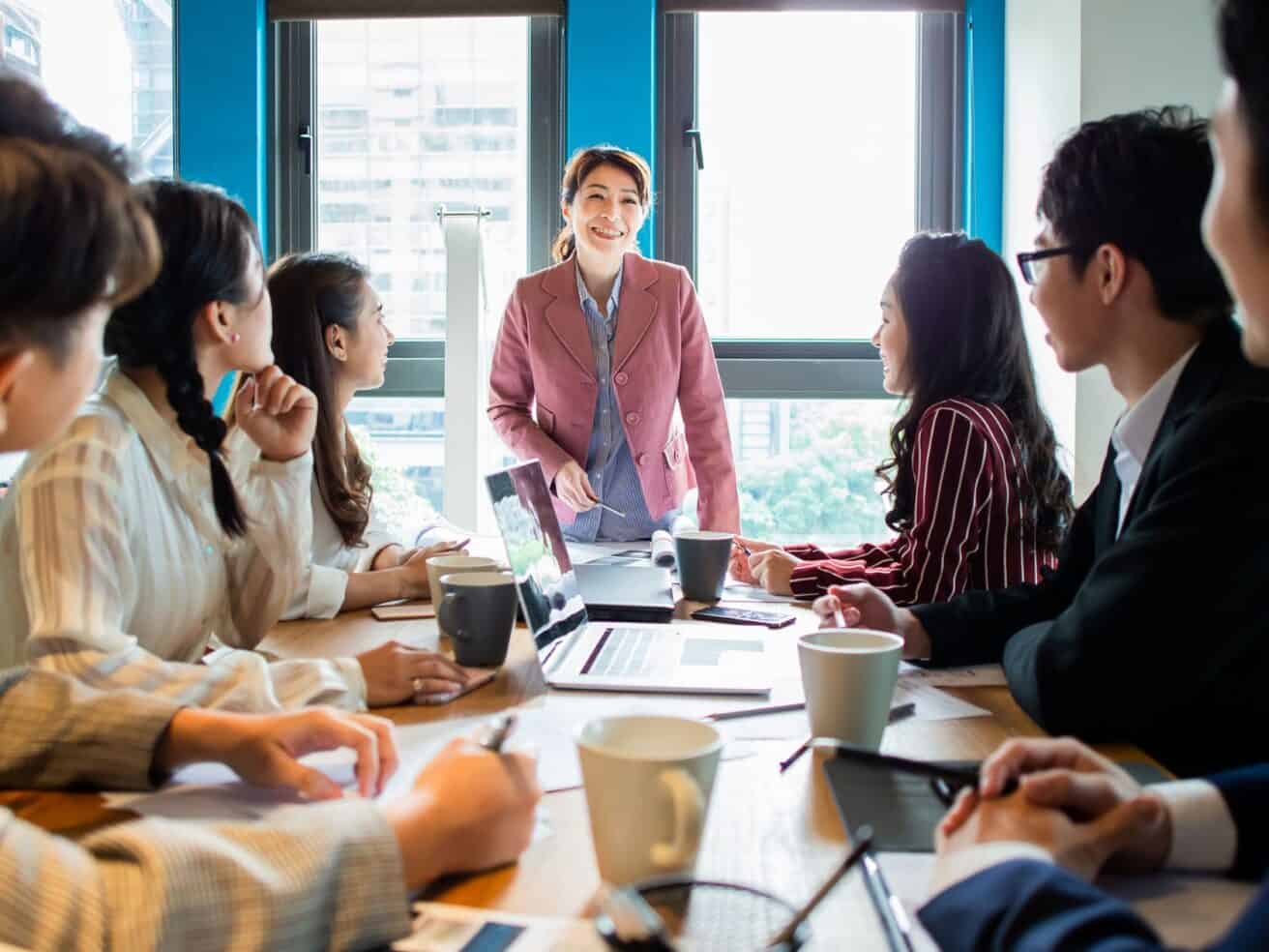 group of colleagues in office environment