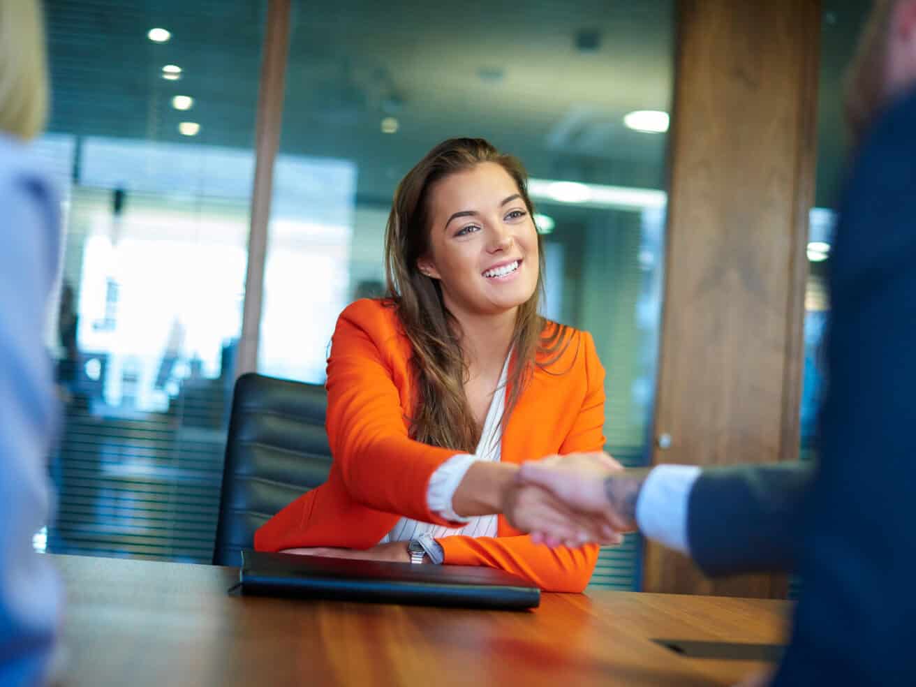 Intern at an interview shaking hands with employer
